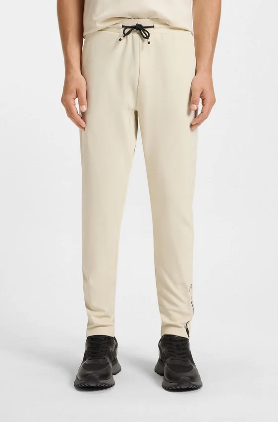 Active stretch-gabardine tracksuit bottoms with thermoregulating technology Active stretch-gabardine tracksuit bottoms with thermoregulating technology