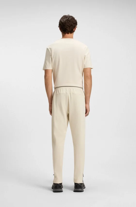 Active stretch-gabardine tracksuit bottoms with thermoregulating technology Active stretch-gabardine tracksuit bottoms with thermoregulating technology