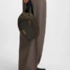 Belt bag with antique-effect logo plaque