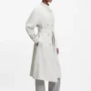 Belted coat with double-breasted closure