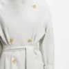 Belted coat with double-breasted closure