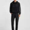 Black tapered-fit jeans in grain-effect denim Black tapered-fit jeans in grain-effect denim