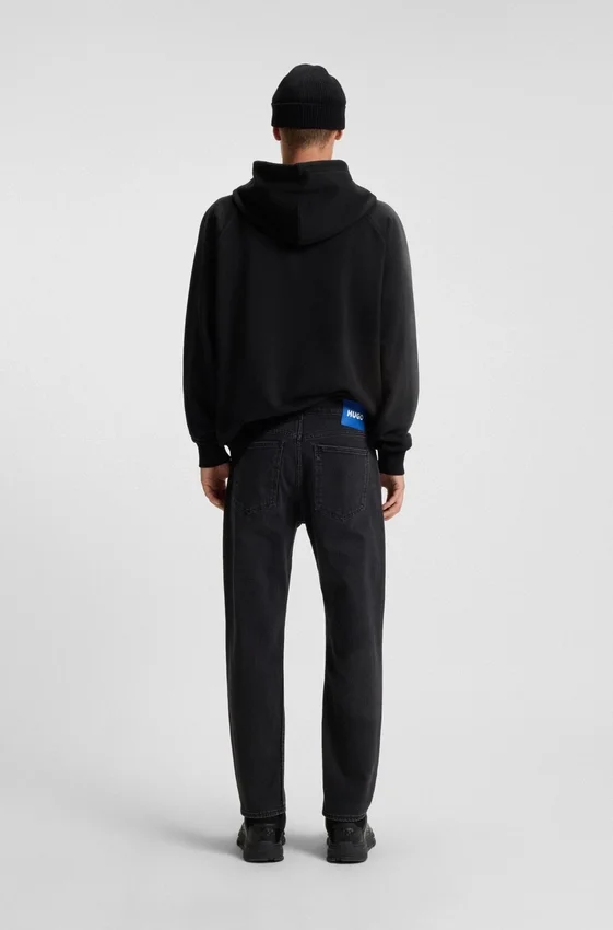 Black tapered-fit jeans in grain-effect denim Black tapered-fit jeans in grain-effect denim