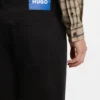Black tapered-fit jeans in stretch denim
