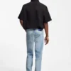 Blue tapered-fit jeans in distressed denim