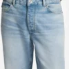 Blue tapered-fit jeans in distressed denim