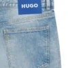 Blue tapered-fit jeans in distressed denim