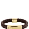 Brown braided leather cuff with gold-tone logo plate