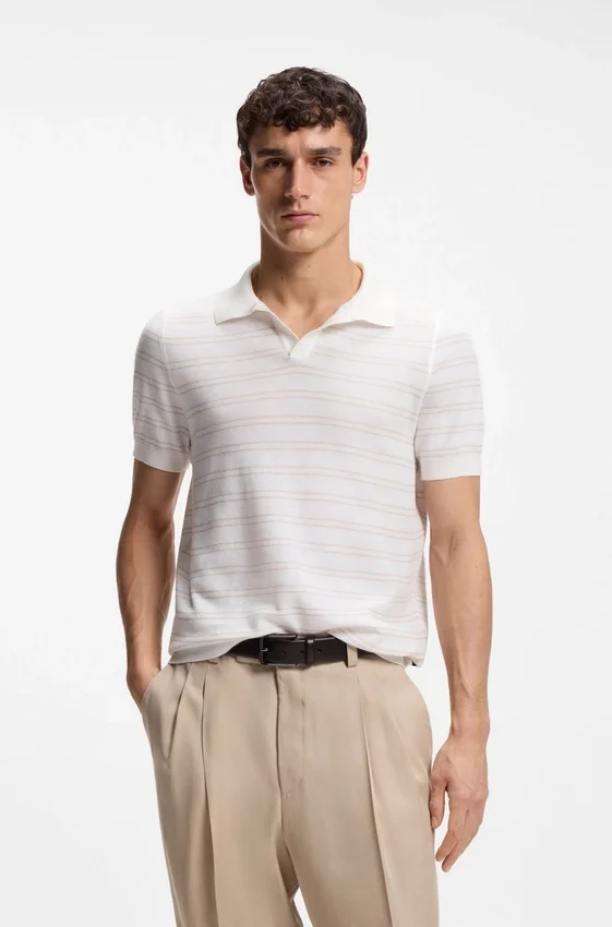 Cotton-blend knit polo with horizontal stripe. Cotton-blend knit polo with horizontal stripe.