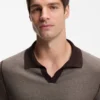 Cotton-blend knit polo with horizontal stripe.