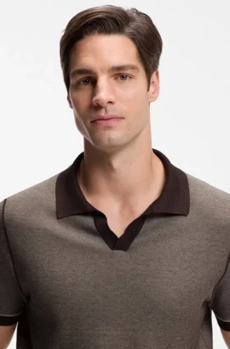 Cotton-blend knit polo with horizontal stripe.