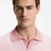 Cotton-blend knit polo with horizontal stripe.