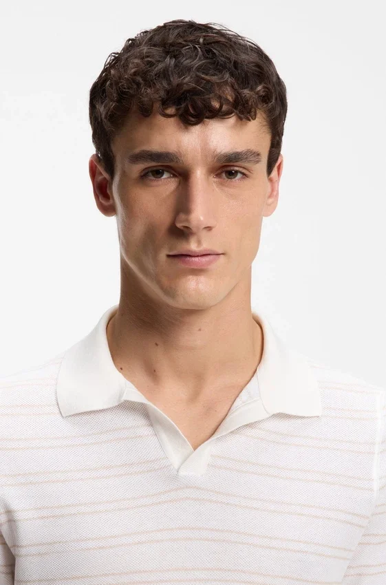 Cotton-blend knit polo with horizontal stripe. Cotton-blend knit polo with horizontal stripe.