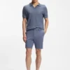 Cotton-blend knit polo with horizontal stripe.