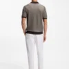Cotton-blend knit polo with horizontal stripe.