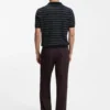 Cotton-blend knit polo with horizontal stripe.