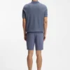 Cotton-blend knit polo with horizontal stripe.