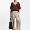 Cotton-blend knit top with cable detailing
