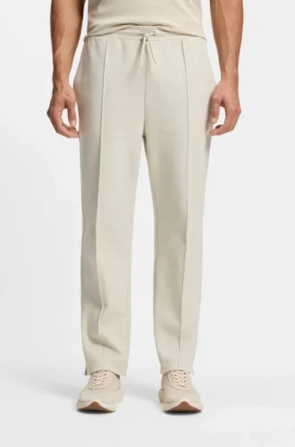 Cotton-blend tracksuit bottoms with tennis-themed logo Cotton-blend tracksuit bottoms with tennis-themed logo