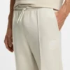 Cotton-blend tracksuit bottoms with tennis-themed logo