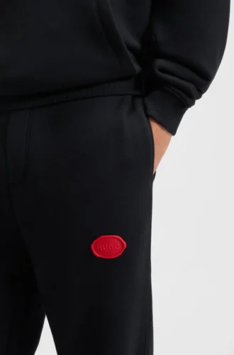 Cotton-blend tracksuit bottoms with waxed-stamp logo Cotton-blend tracksuit bottoms with waxed-stamp logo