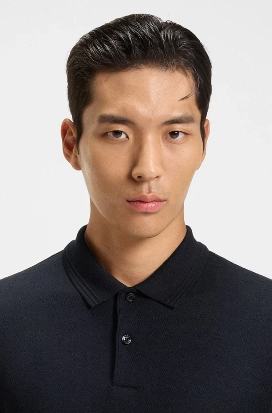 Cotton polo shirt with herringbone structure Cotton polo shirt with herringbone structure