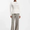 Cotton sweater with detachable floral brooch
