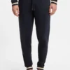 Cotton-terry tracksuit bottoms with signature stripes and logo