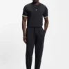Cotton-terry tracksuit bottoms with signature stripes and logo