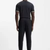 Cotton-terry tracksuit bottoms with signature stripes and logo