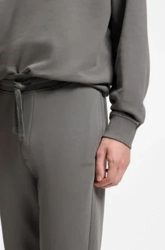 Cuffed sweatpants in cotton terry with logo print