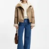 Detachable-sleeve jacket in faux shearling