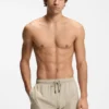 Drawstring swim shorts in stretch fabric with tape trim