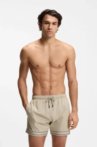 Drawstring swim shorts in stretch fabric with tape trim