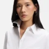 Easy-iron slim-fit blouse in cotton-blend poplin Easy-iron slim-fit blouse in cotton-blend poplin