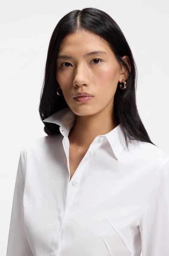 Easy-iron slim-fit blouse in cotton-blend poplin Easy-iron slim-fit blouse in cotton-blend poplin