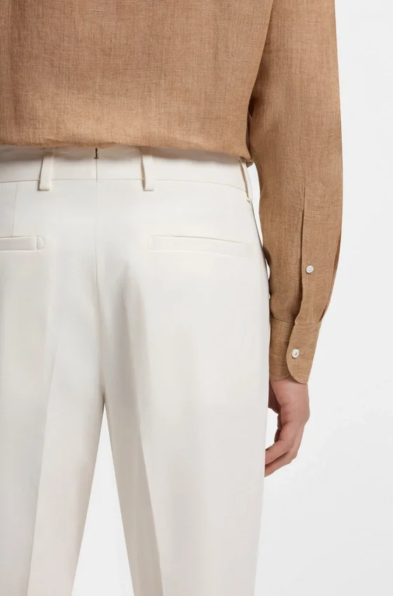 Easy-iron tapered-fit trousers in stretch-cotton poplin Easy-iron tapered-fit trousers in stretch-cotton poplin