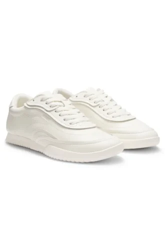 Embossed-logo trainers in leather