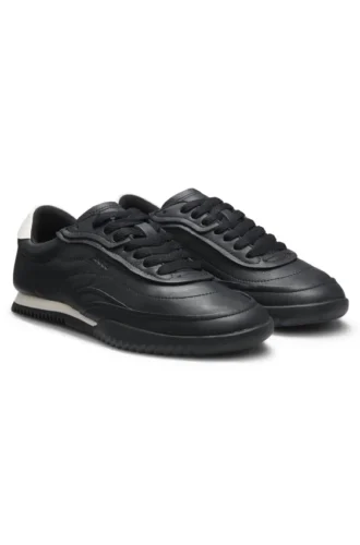 Embossed-logo trainers in leather
