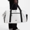 Faux-leather holdall with reflective zips