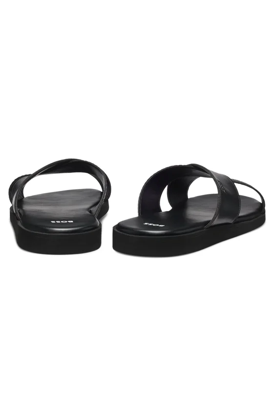 Faux-leather slides with plain and patterned straps Faux-leather slides with plain and patterned straps