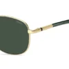 Gold-tone sunglasses with green trims Gold-tone sunglasses with green trims