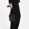 Grained reporter bag with stacked-logo trim