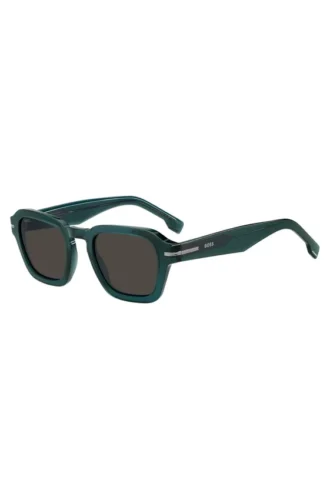 Green acetate sunglasses with temple logo