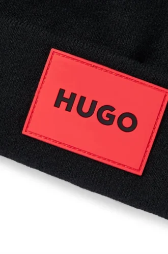 Kids’ beanie hat with red rubber logo label Kids’ beanie hat with red rubber logo label