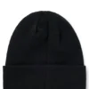 Kids’ beanie hat with red rubber logo label Kids’ beanie hat with red rubber logo label