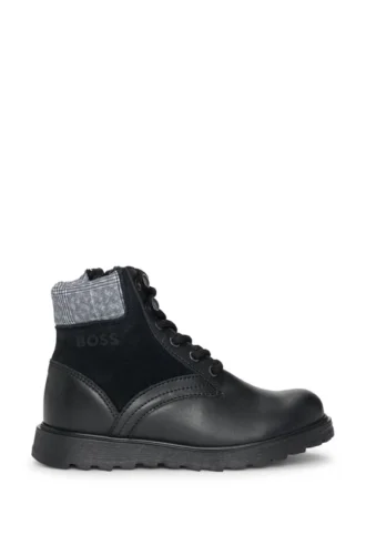 Kids’ boots in leather with faux-shearling lining