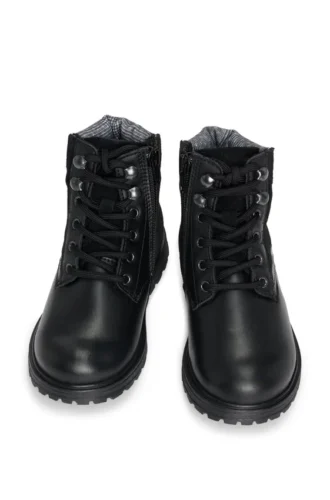 Kids’ boots in leather with faux-shearling lining