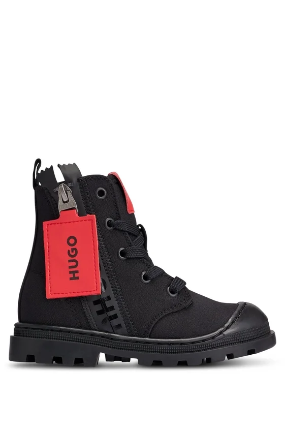Kids’ boots with branded leather zip puller Kids’ boots with branded leather zip puller