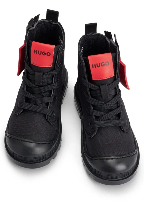 Kids’ boots with branded leather zip puller Kids’ boots with branded leather zip puller